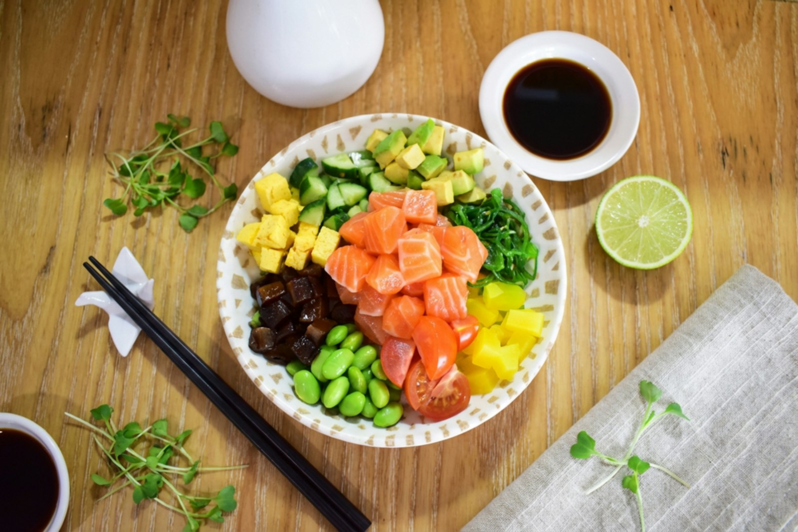 A salmon and avocado bowl with fresh vegetables, rich in protein and omega-3 fats that support health during menopause